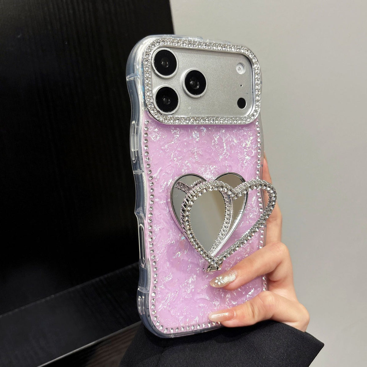 Rhinestone-studded heart-shaped mirror stand iPhone case with a shell pattern