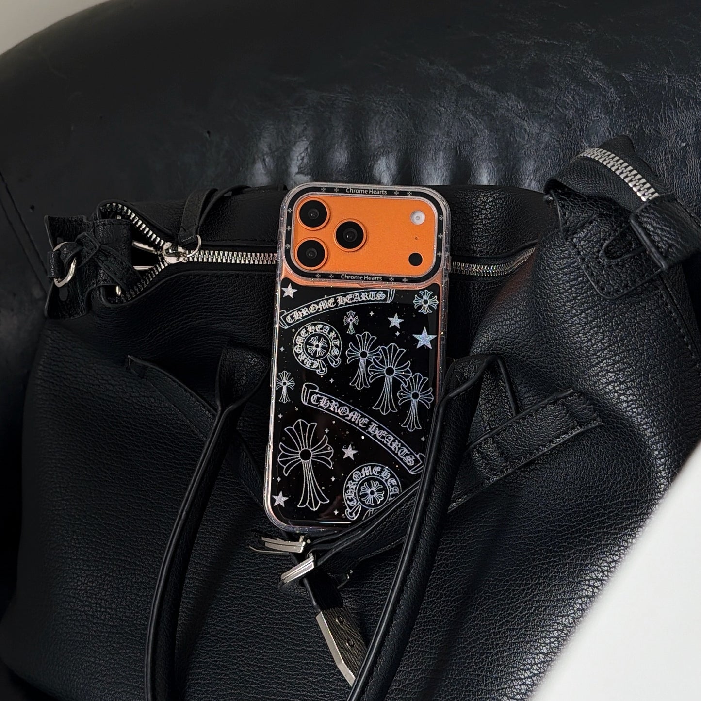 Premium-feel full-coverage Chrome Hearts-style iPhone case