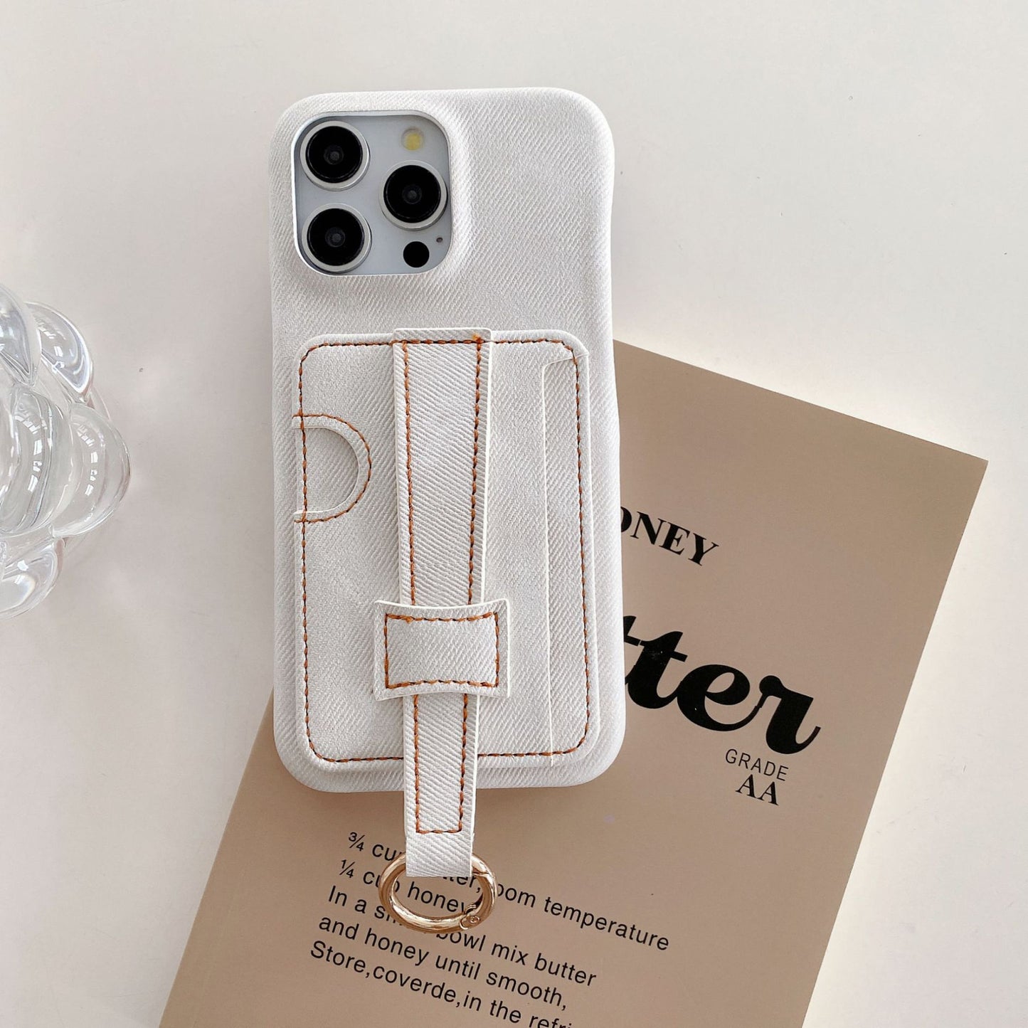 Denim-textured iPhone case with wrist strap and ring holder