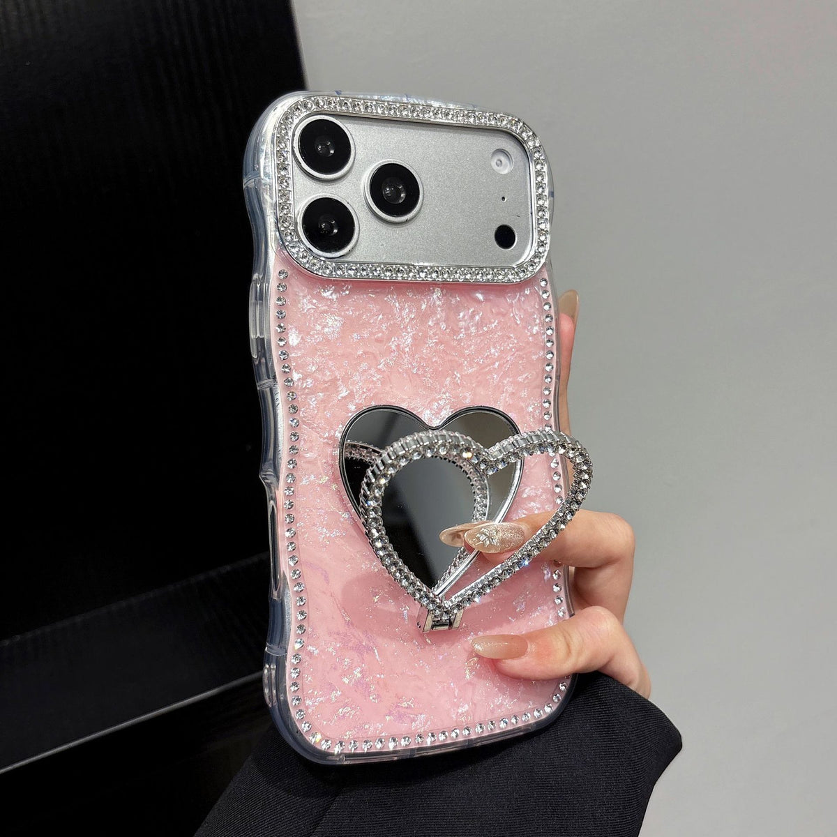 Rhinestone-studded heart-shaped mirror stand iPhone case with a shell pattern