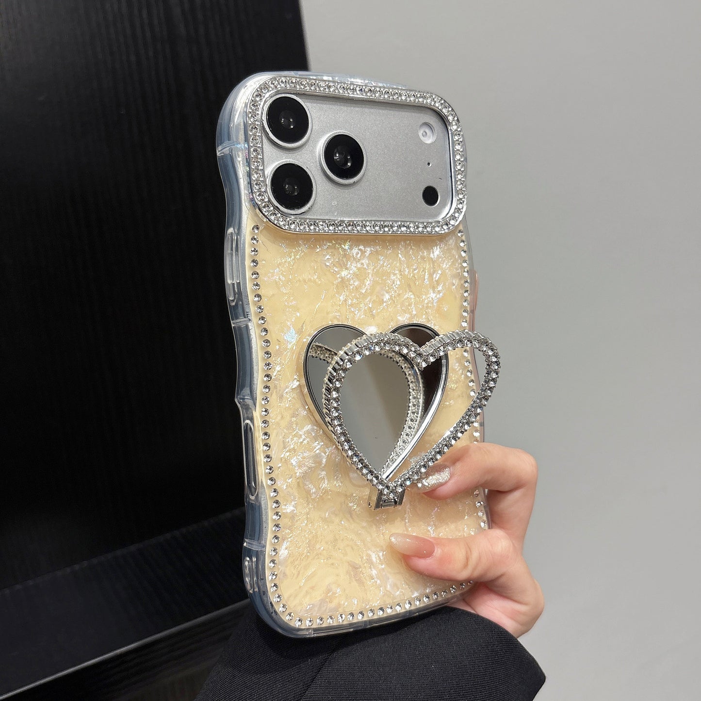 Rhinestone-studded heart-shaped mirror stand iPhone case with a shell pattern