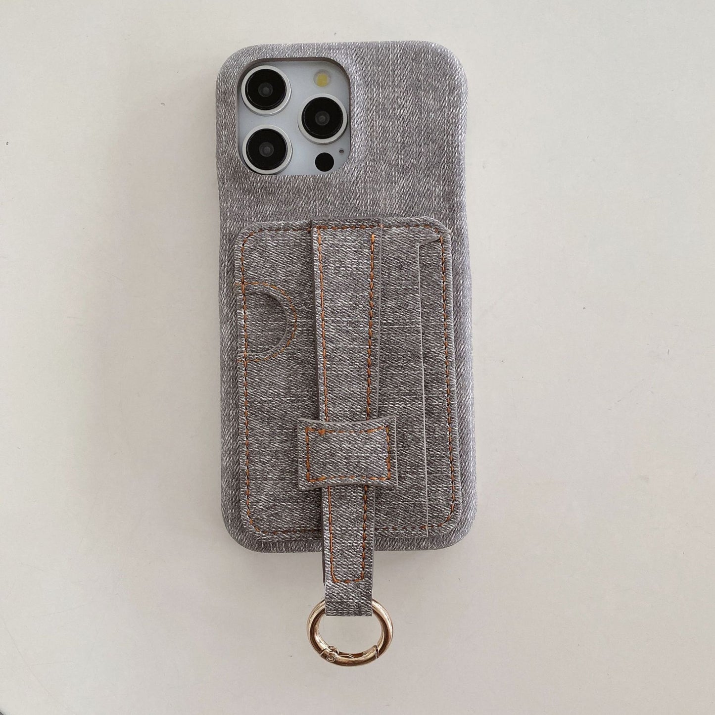 Denim-textured iPhone case with wrist strap and ring holder