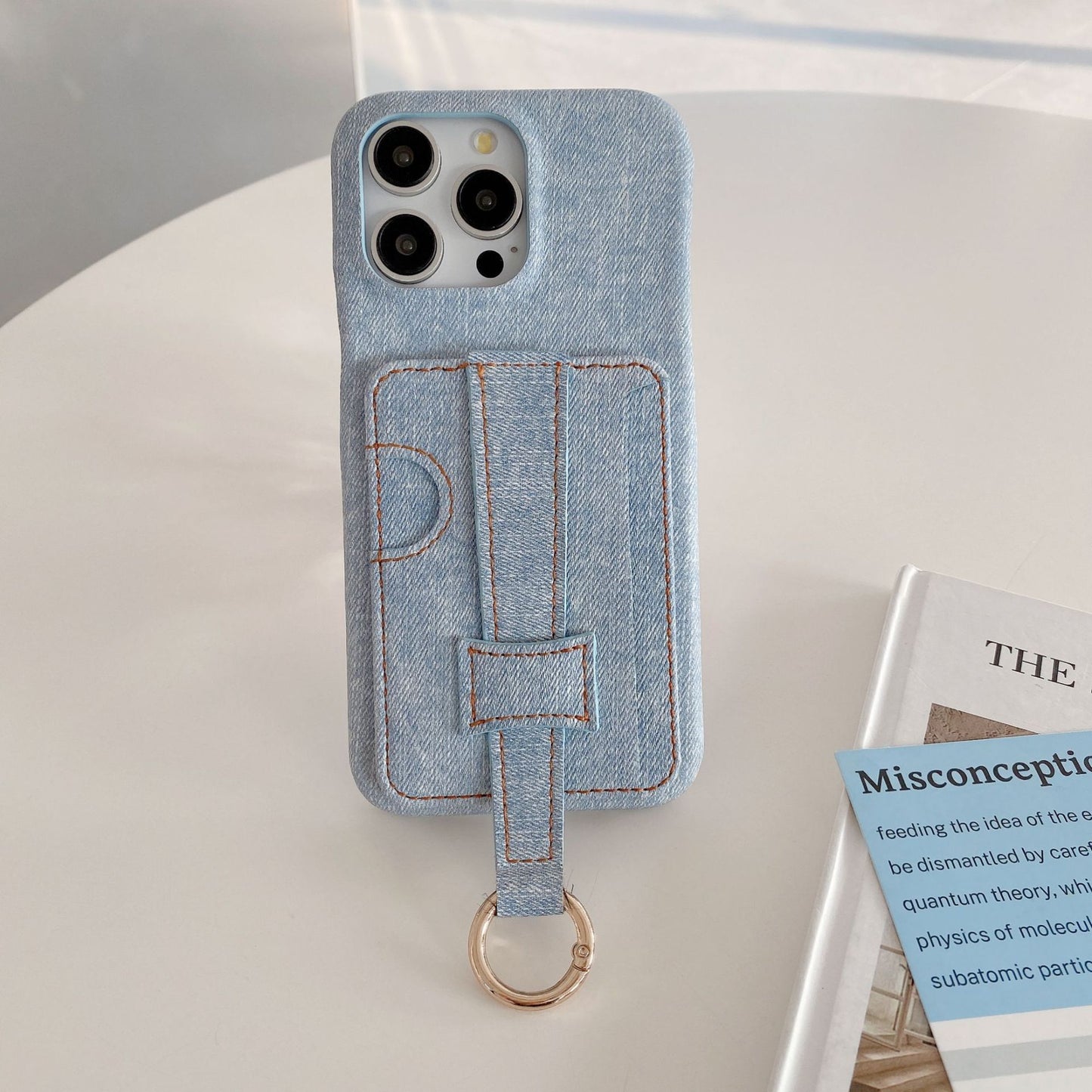 Denim-textured iPhone case with wrist strap and ring holder