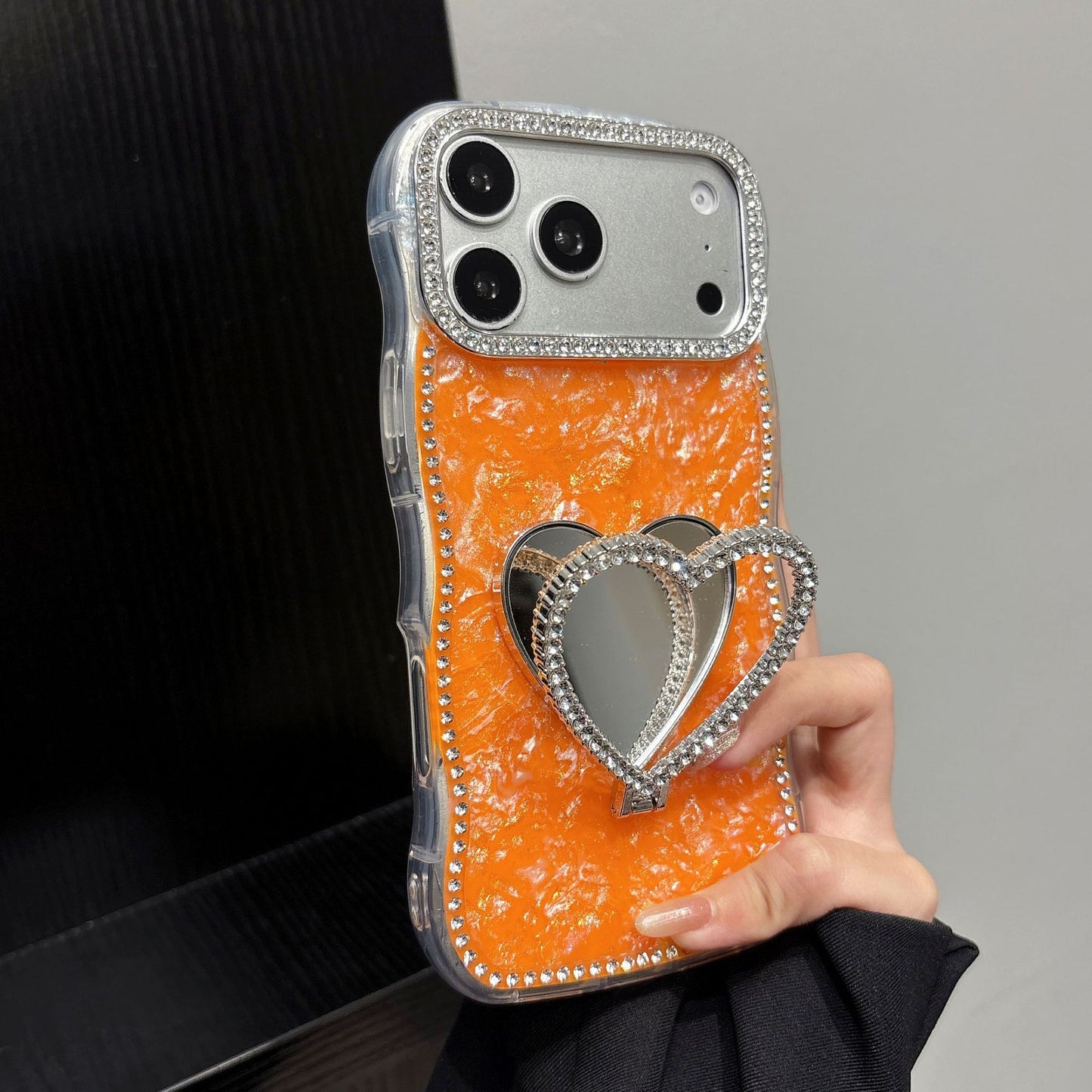 Rhinestone-studded heart-shaped mirror stand iPhone case with a shell pattern