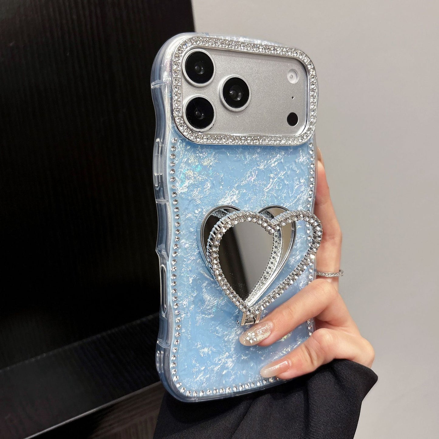 Rhinestone-studded heart-shaped mirror stand iPhone case with a shell pattern